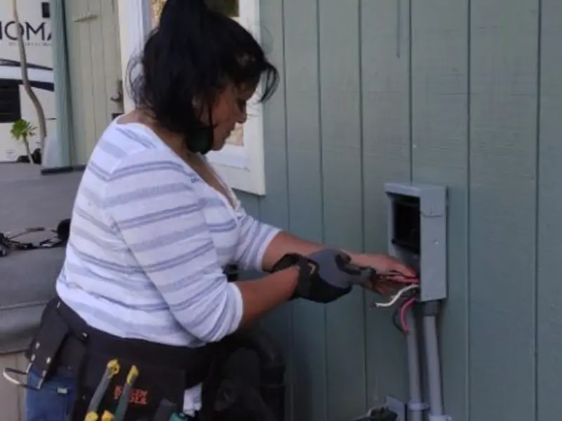 Licensed electrician wiring an exterior subpanel in Camden